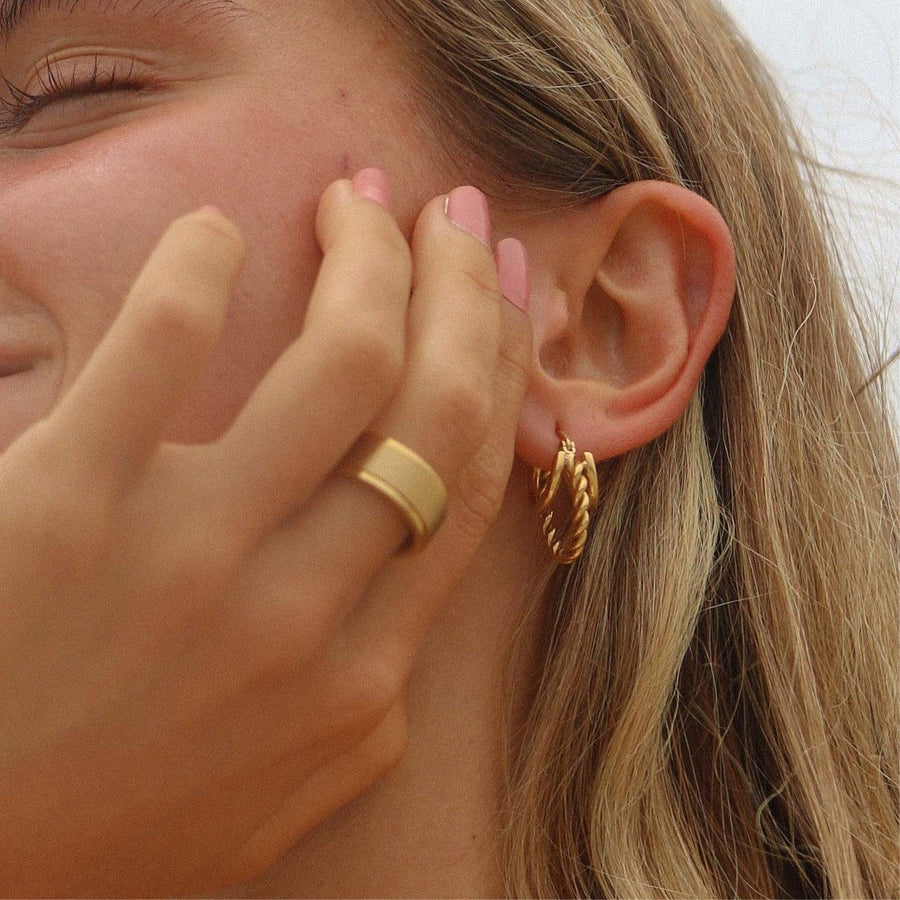 Woman wearing gold hoop earrings and gold ring - womens jewellery by Australian waterproof jewellery brands indie and harper