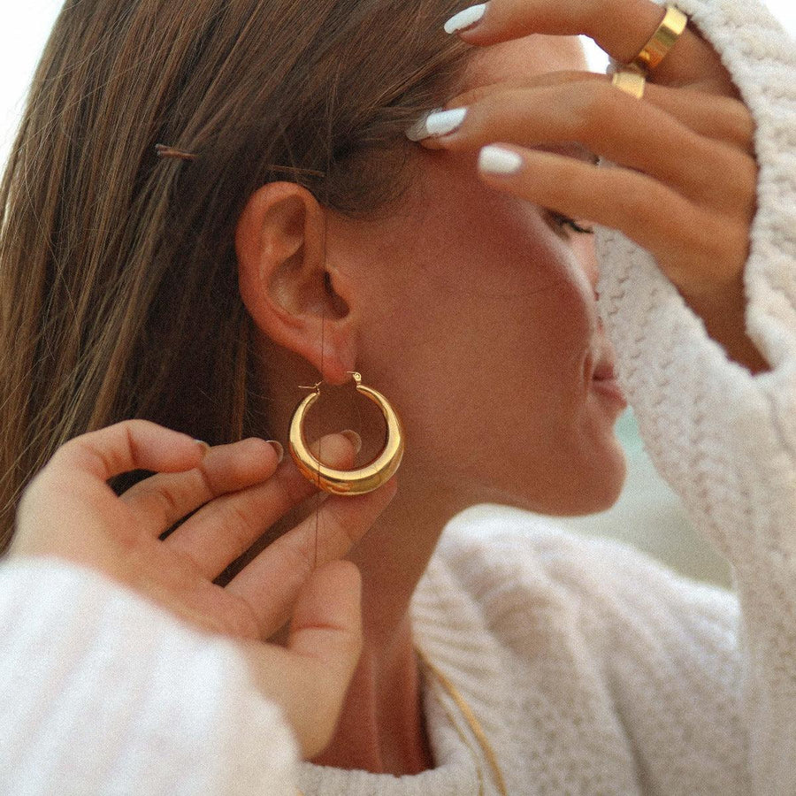 woman wearing chunky gold hoop Earrings - gold jewellery by Australian jewellery brands indie and Harper