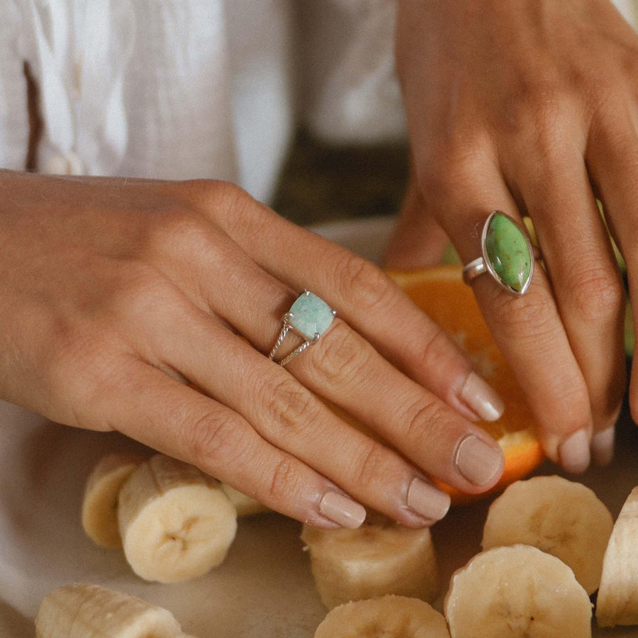 womans hands with bananas and orange wearing boho jewellery - womens gemstone jewellery by australian jewellery brands indie and Harper