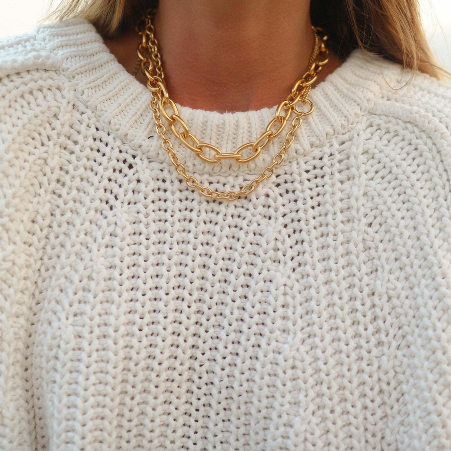 woman wearing chunky gold chain necklaces - gold jewellery by australian jewellery brands indie and harper