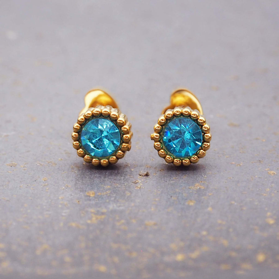 dainty stud earrings with blue cubic zirconia and gold plating over stainless steel - women's earrings set by online jewellery brand indie and harper