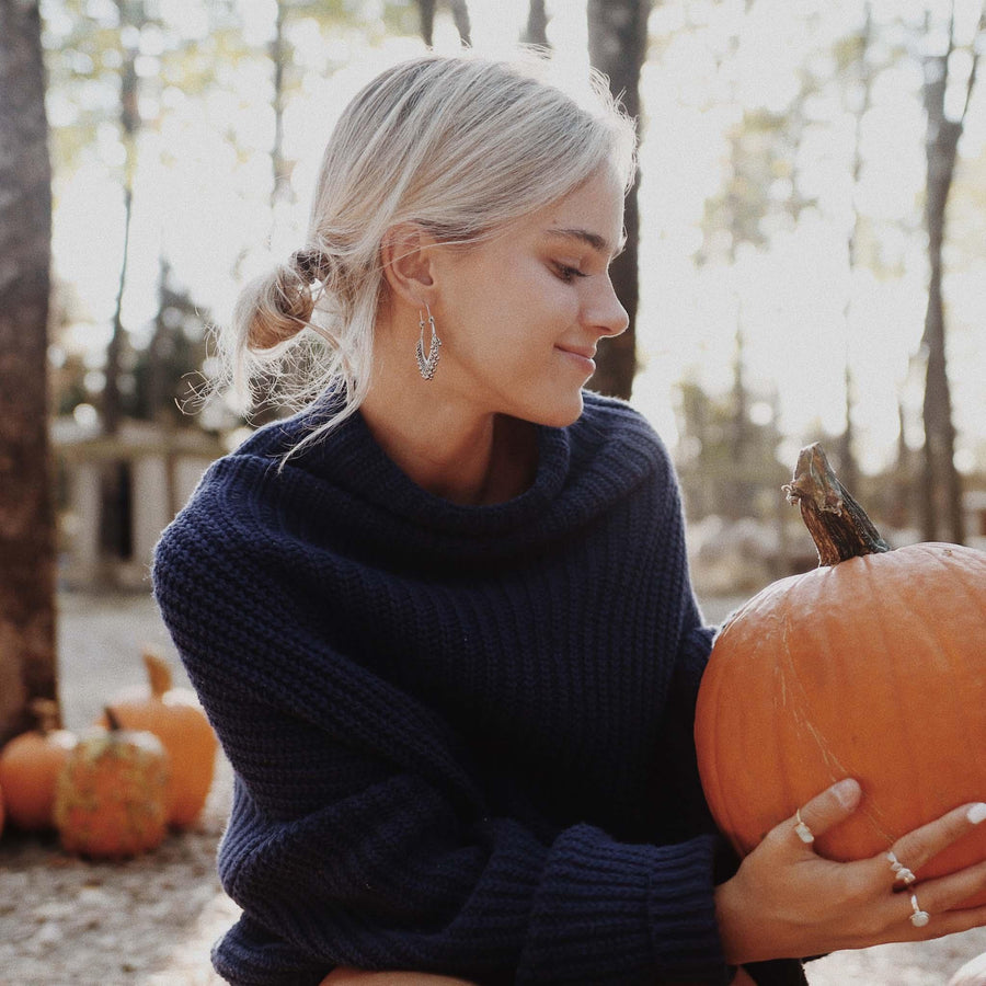 woman holding a pumpkin wearing boho earrings - boho jewellery by Australian jewellery brands indie and Harper 