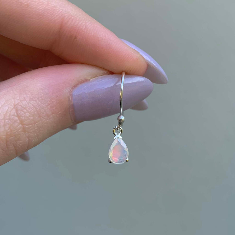 classic opal earrings being held - dainty opal jewellery by Australian jewellery brands indie and harper