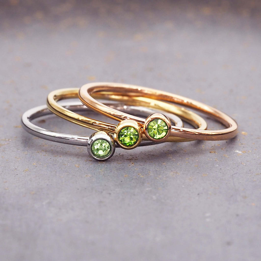dainty birthstone ring - august birthstone jewellery made with stainless steel, gold and rose gold plating and green cubic zirconia - dainty august birthstone ring by online jewellery brand indie and harper