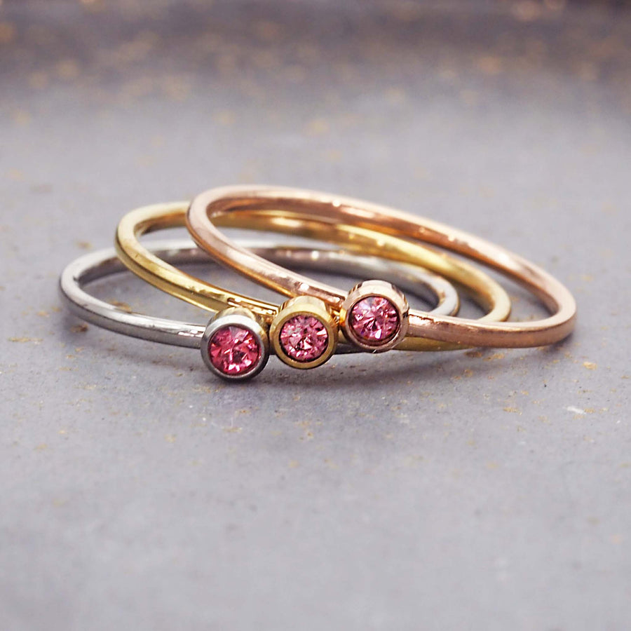 dainty birthstone ring - dainty july birthstone jewellery made with stainless steel, gold and rose gold plating with a dainty pink cubic zirconia gemstone - dainty july birthstone ring by online jewellery brand indie and harper