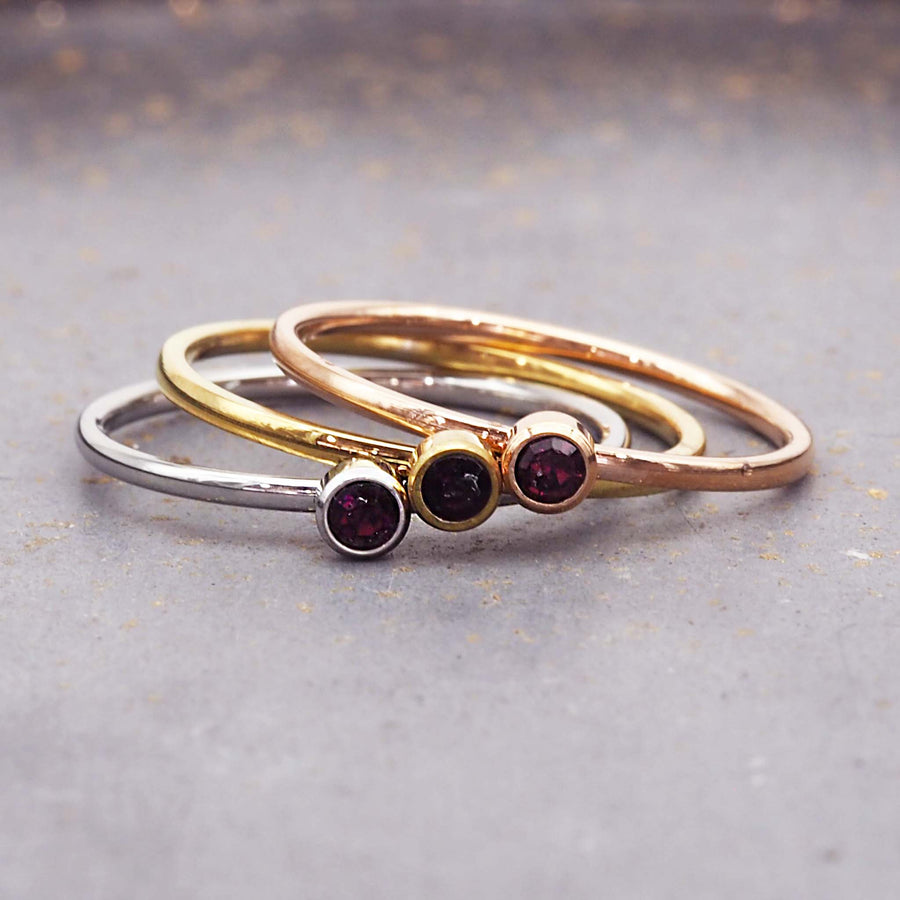 dainty birthstone ring - june birthstone jewellery made with stainless steel, gold and rose gold plating and deep purple cubic zirconia gemstone - dainty rose gold june birthstone ring by online jewellery brand indie and harper