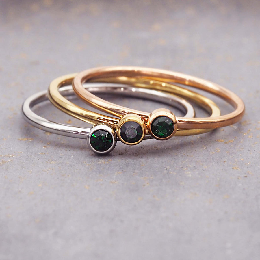 dainty birthstone ring - dainty may birthstone jewellery made with emerald green cubic zirconia, stainless steel, gold and rose gold plating - dainty may birthstone ring by online jewellery brand indie and harper