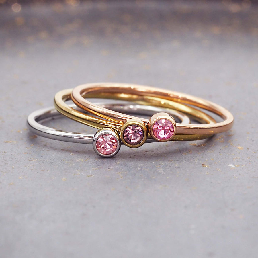 dainty birthstone ring - pink cubic zirconia gemstones with stainless steel, gold and rose gold plating - dainty october birthstone ring by online jewellery brand indie and harper
