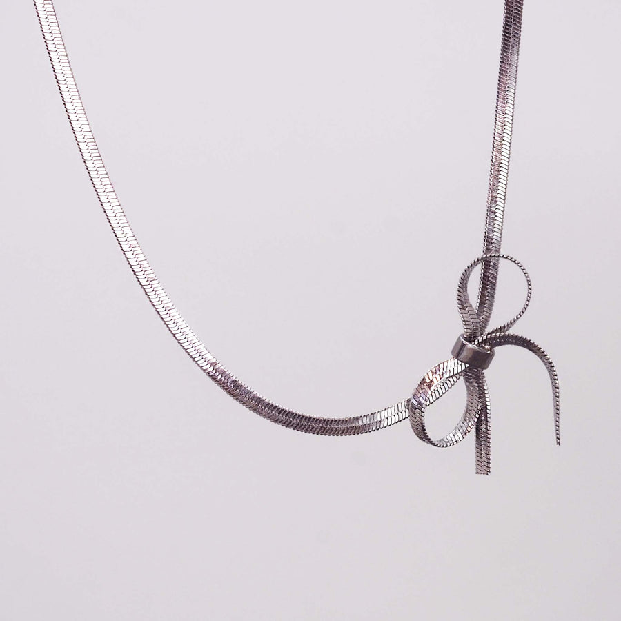 dainty bow choker necklace - stainless steel necklace made with delicate snake chain and dainty bow detailing - waterproof jewellery by online jewellery brand indie and harper