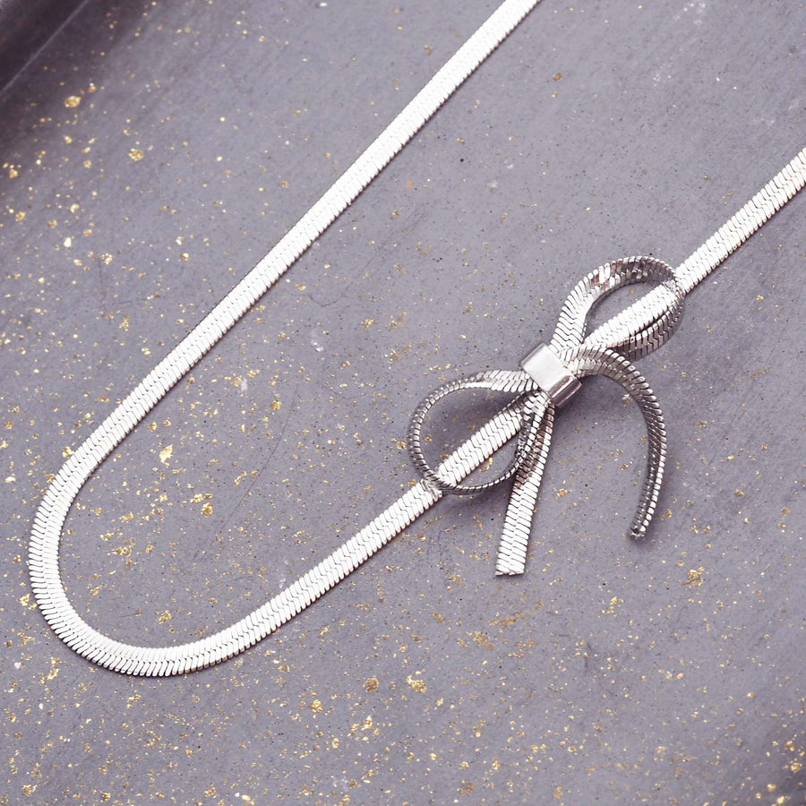 dainty bow choker necklace - stainless steel waterproof necklace with dainty bow design and snake chain - waterproof jewellery for women by online jewellery brand indie and harper
