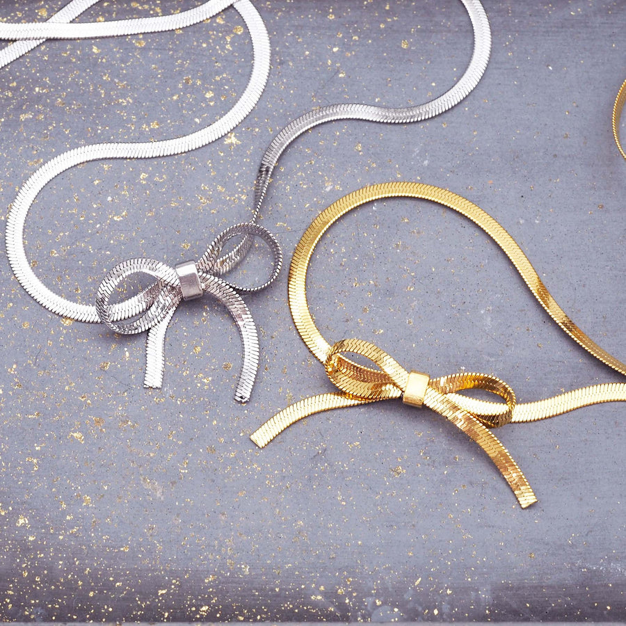 dainty bow choker necklace - made with stainless steel and 18k gold plating - beautiful snake chain with bow design - women's jewellery online by indie and harper