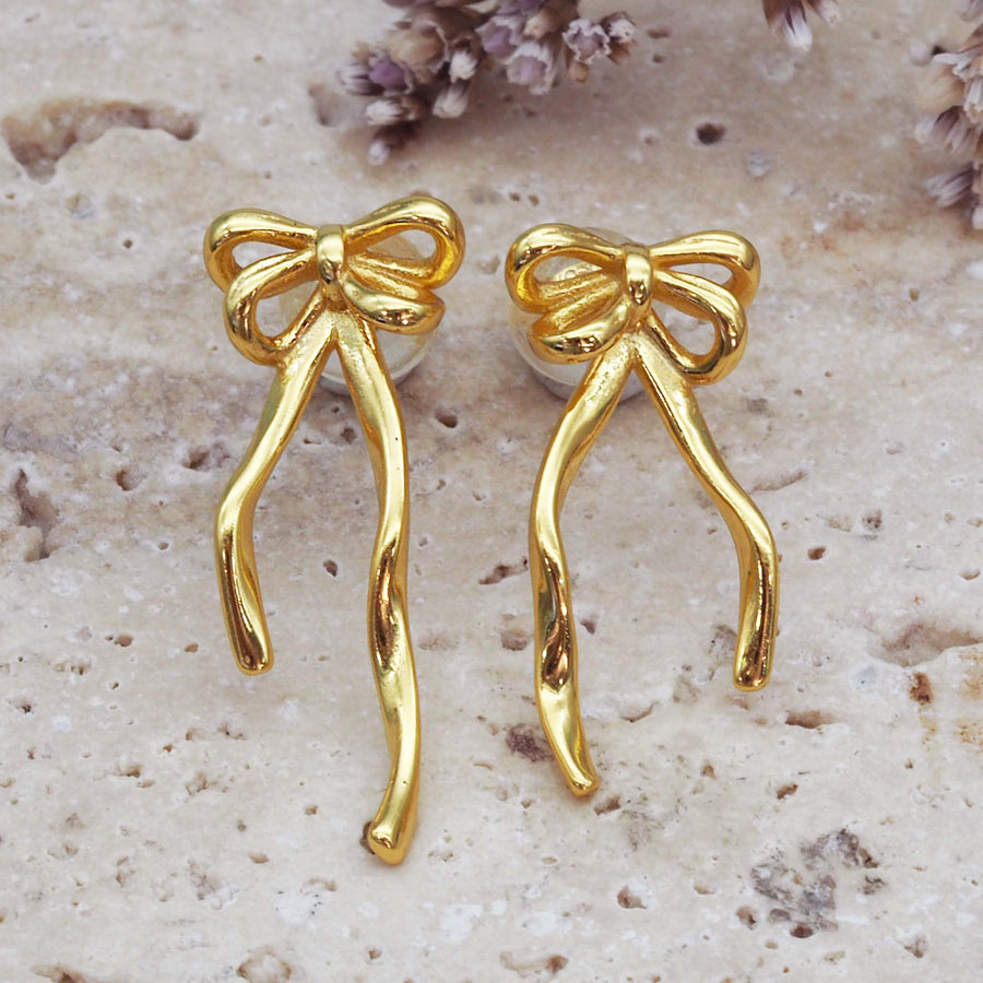 dainty bow earrings - sterling silver earrings with 18k gold plating and a dainty bow design with classic post and backing - buy dainty jewellery with online jewellery brand indie and harper