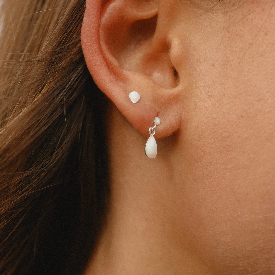 Woman wearing Dainty white Opal Earrings - womens opal jewellery by australian jewellery brands indie and Harper