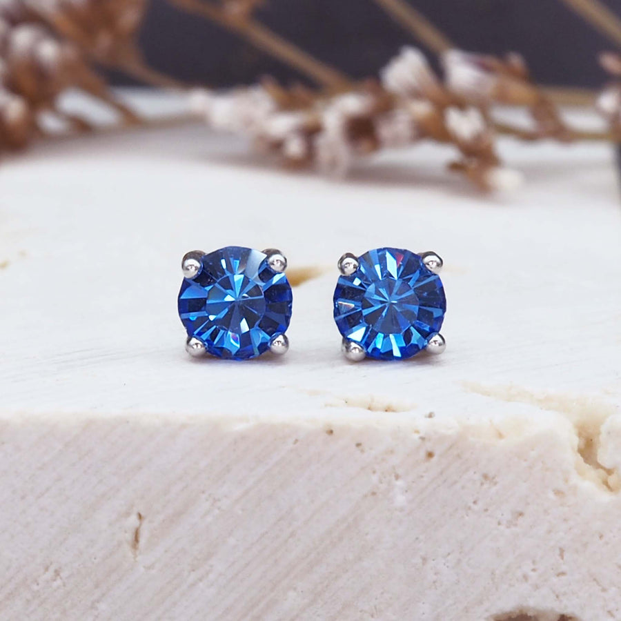 dainty gemstone earrings - bright blue claw set gemstone earrings made with sterling silver - dainty earrings for women by online jewellery brand indie and harper