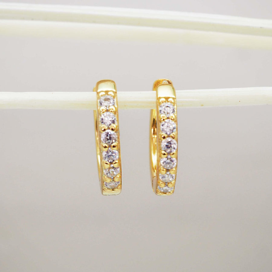 Gold huggie earrings with cubic zirconias - womens gold jewellery by Australian jewellery brands indie and harper