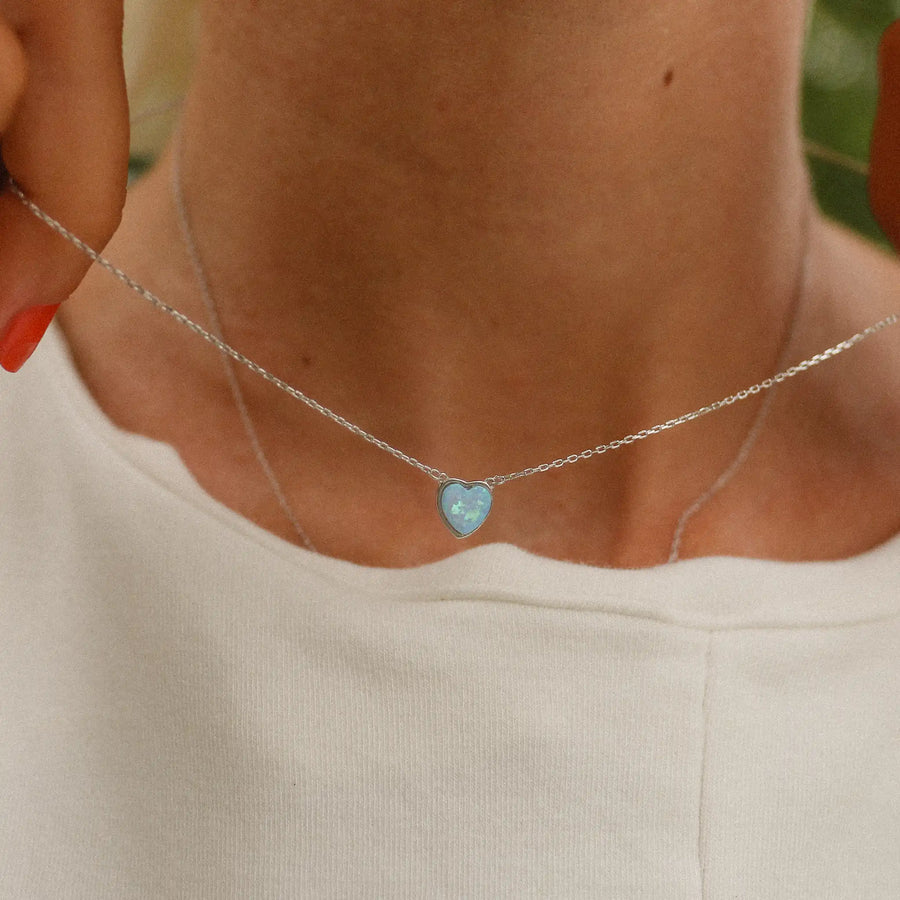 sterling silver necklace with blue synthetic opal in the shape of a heart - gifting jewellery by indie and harper