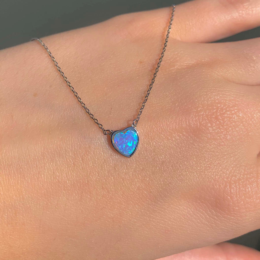 dainty opal heart necklace - women's sterling silver necklace with synthetic blue opal in the natural sunlight - shop dainty necklaces by online jewellery brand indie and harper