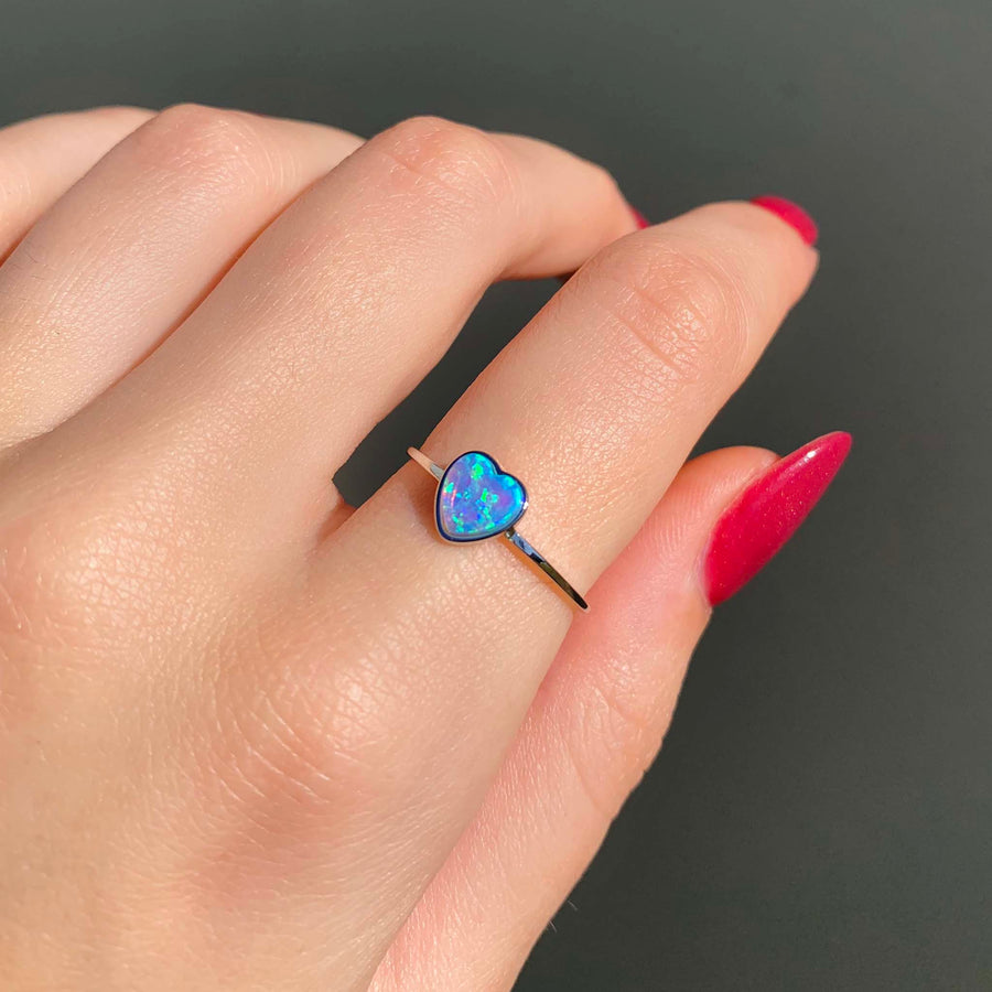 Sterling silver dainty heart blue opal Ring being worn - womens opal jewelry by online jewelry brand indie and Harper