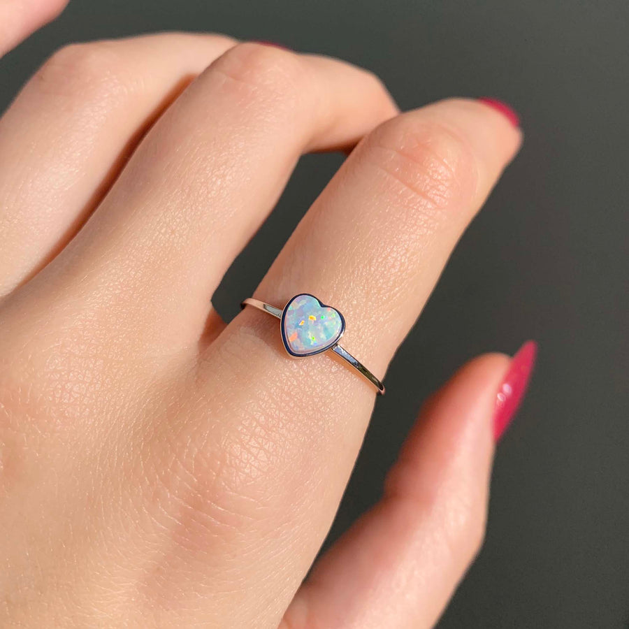 Sterling silver dainty heart opal Ring being worn - womens opal jewelry by online jewelry brand indie and Harper