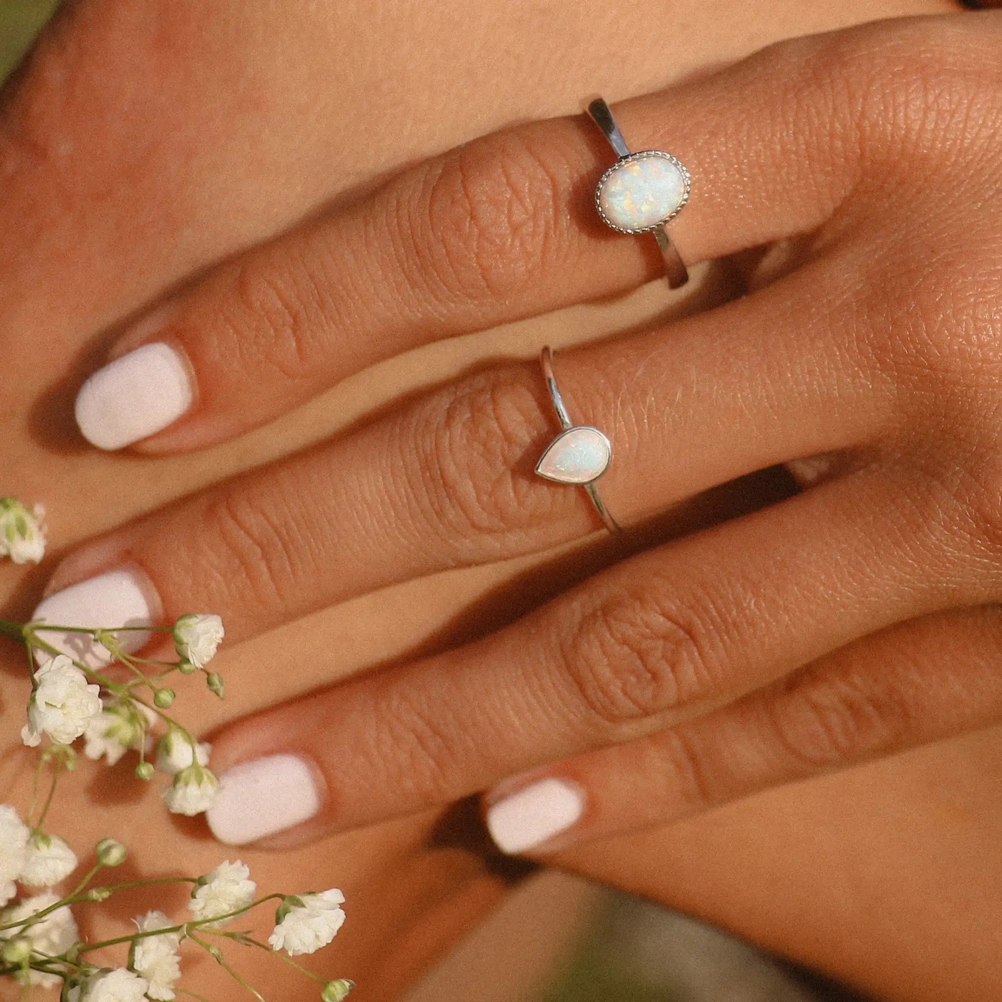 Woman wearing sterling silver dainty white Opal Rings - womens opal jewellery by australian jewellery brands indie and Harper