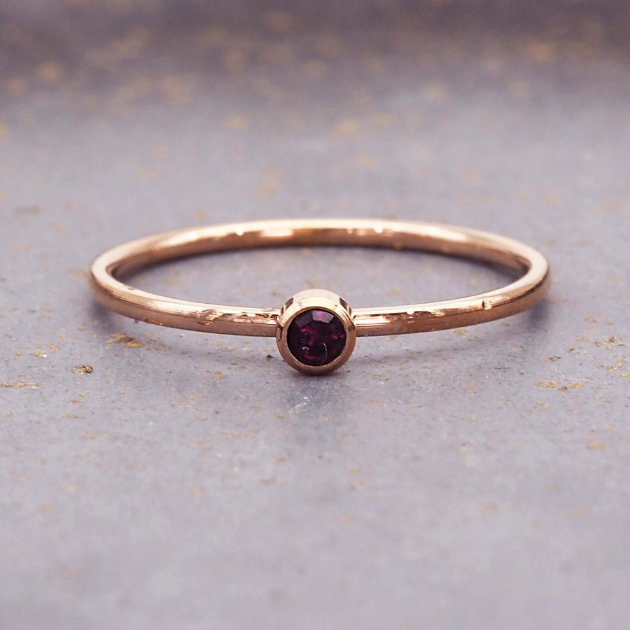 dainty rose gold birthstone ring - june birthstone jewellery made with dainty deep purple cubic zirconia gemstone, stainless steel and rose gold plating - dainty rose gold june birthstone ring by online jewellery brand indie and harper