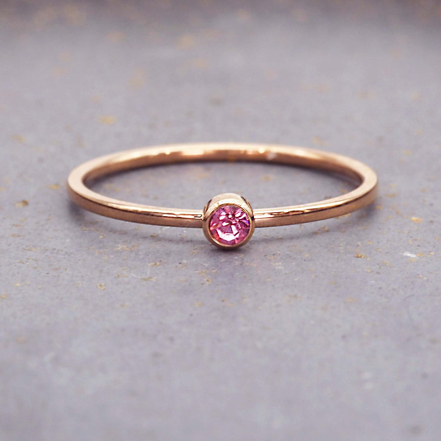 dainty rose gold birthstone ring - rose gold october birthstone jewellery made with pink cubic zirconia, stainless steel and rose gold plating - dainty rose gold october birthstone ring by online jewellery brand indie and harper