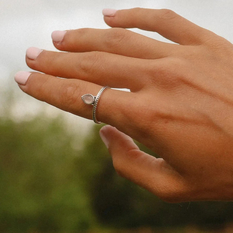 Woman wearing sterling silver dainty rose quartz Ring - Sterling silver promise rings and rose quartz jewellery by australian jewellery brands online indie and Harper