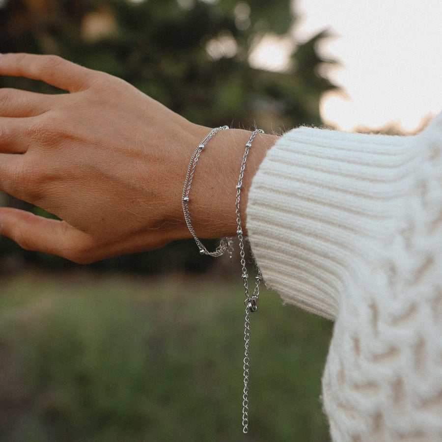 Woman wearing dainty silver Bracelets - womens waterproof jewellery by Australian jewellery brands indie and harper