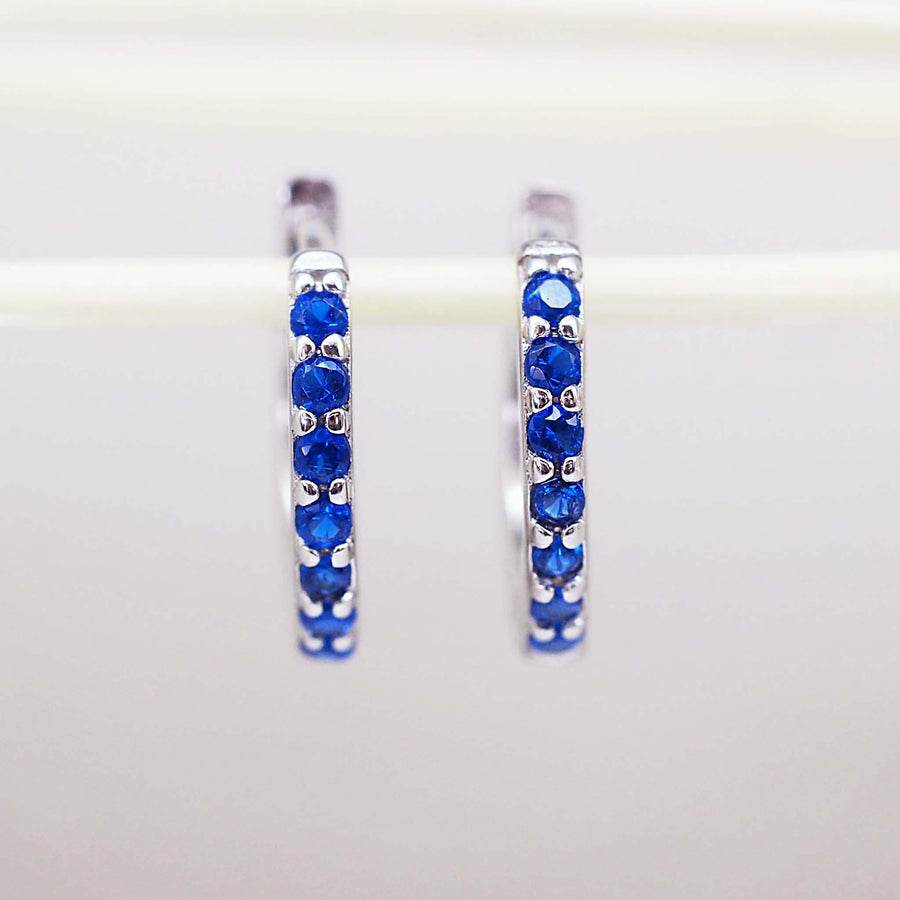 Sterling Silver huggie earrings with blue cubic zirconias - womens jewellery by Australian jewellery brands online indie and Harper 