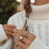 Woman with hair in plaits wearing boho jewelry - Australian jewellery brands