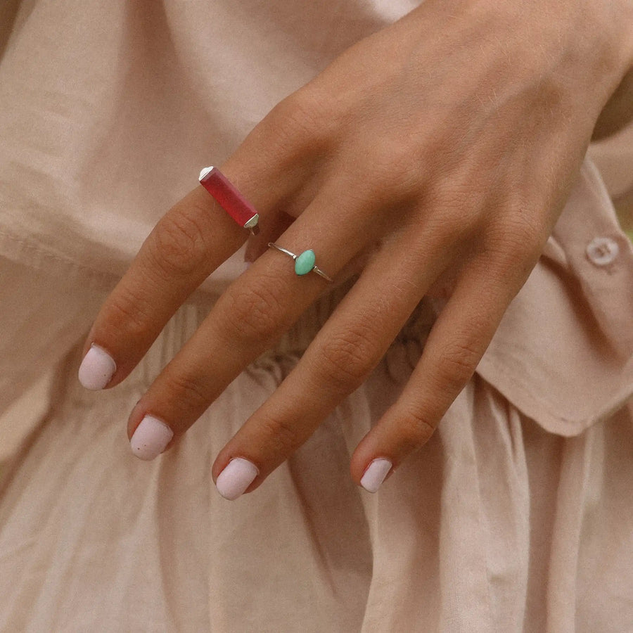 Woman wearing sterling silver dainty turquoise ring and pink jade ring - women’s boho jewellery by australian jewellery brands online indie and Harper