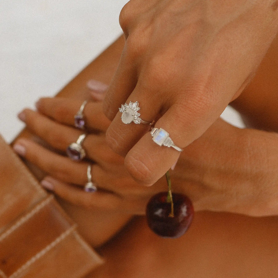 woman wearing sterling silver topaz stone and moonstone rings - moonstone jewellery by australian jewellery brands indie and harper