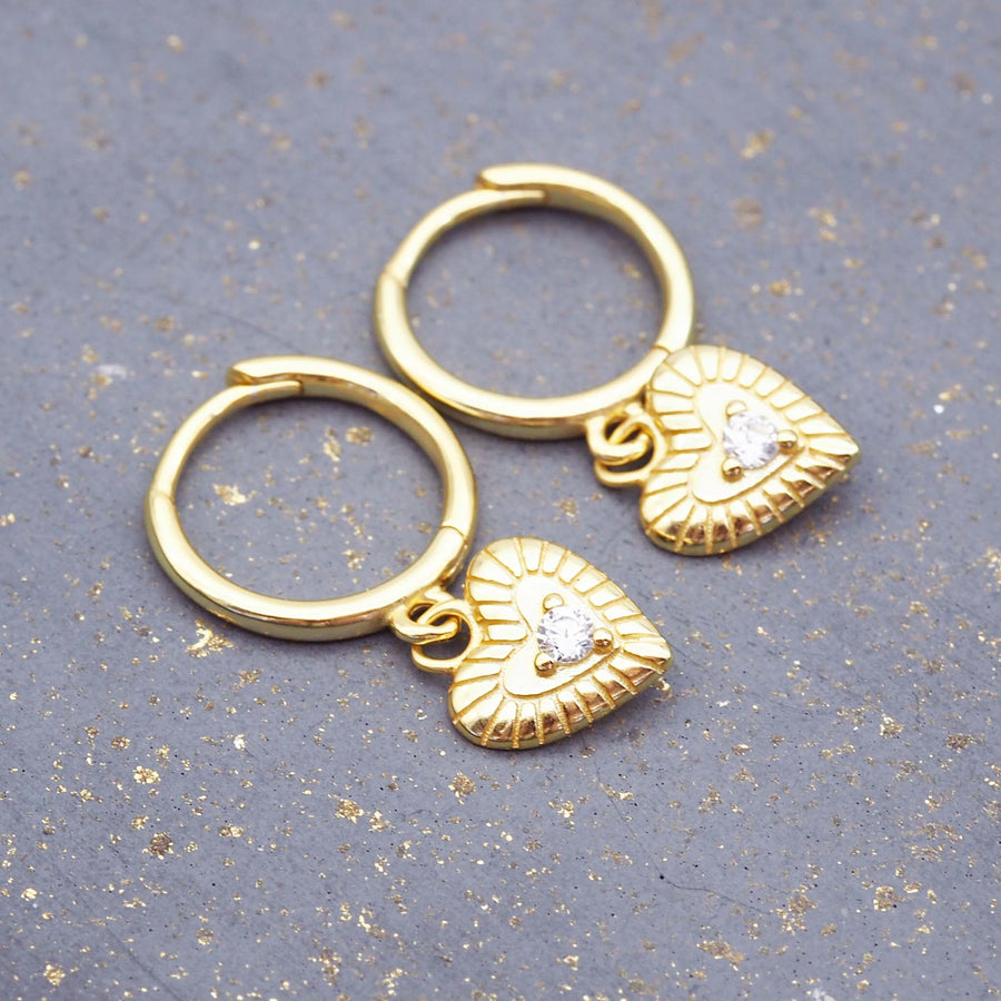 dainty hoop earrings made with gold plating over sterling silver and heart charm with cubic zirconia - women's jewellery online by indie and harper 