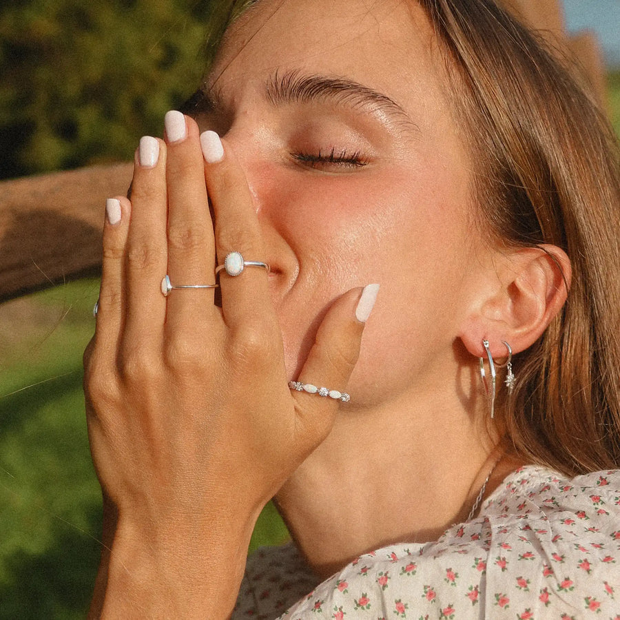 woman wearing three sterling silver opal rings - womens opal jewellery australia - australian jewellery brand