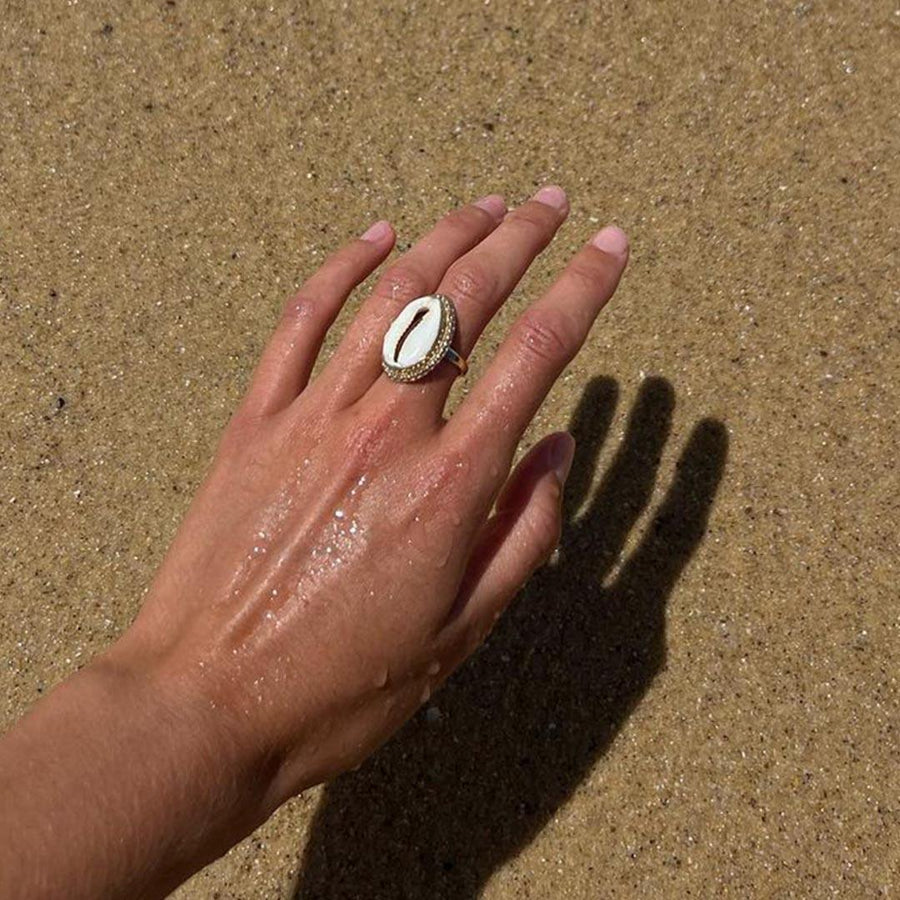 Gold Cowrie Shell Ring being worn - womens cowrie shell jewellery by australian jewellery brands online indie and harper