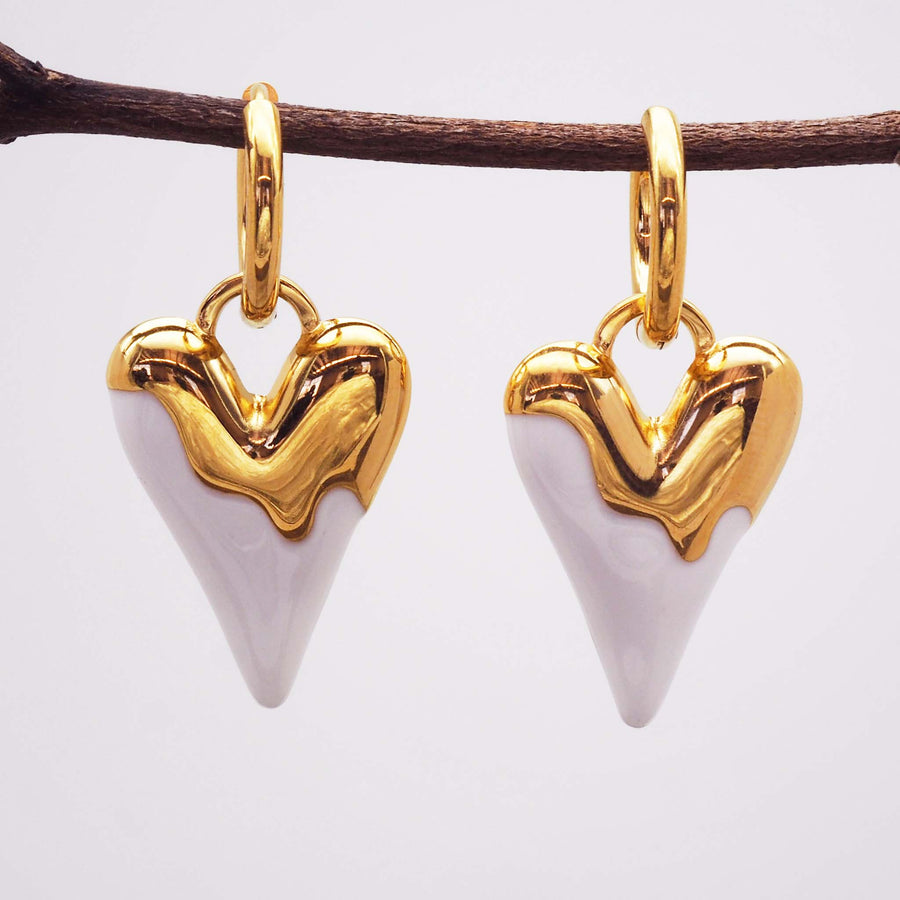 statement heart earrings made with gold plating over stainless steel and white enamel detailing - women's jewellery online by indie and harper