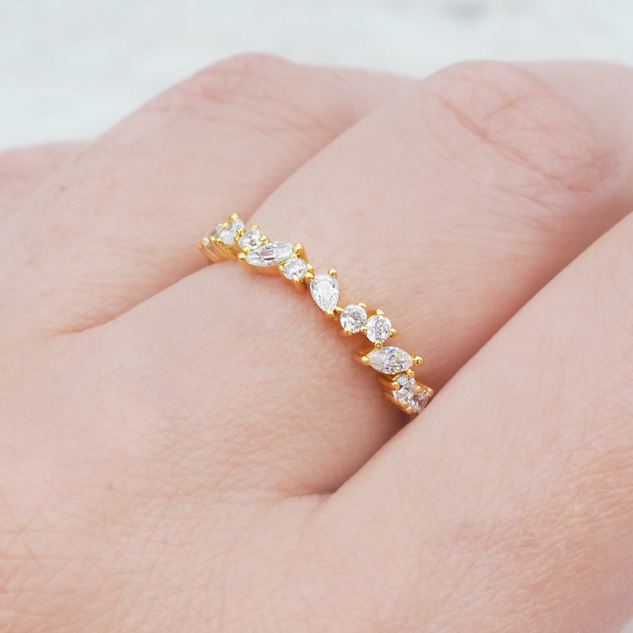 Gold infinity ring being worn - dainty gold jewellery by online jewellery brand indie and Harper 