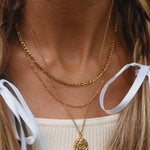 Woman wearing Gold layered Necklaces - gold jewellery by Australian jewellery brands indie and Harper