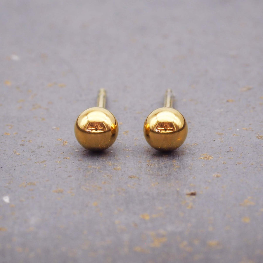 classic gold ball stud made with stainless steel and gold plating - perfect in its own or when paired with hoops - women's jewellery by indie and harper