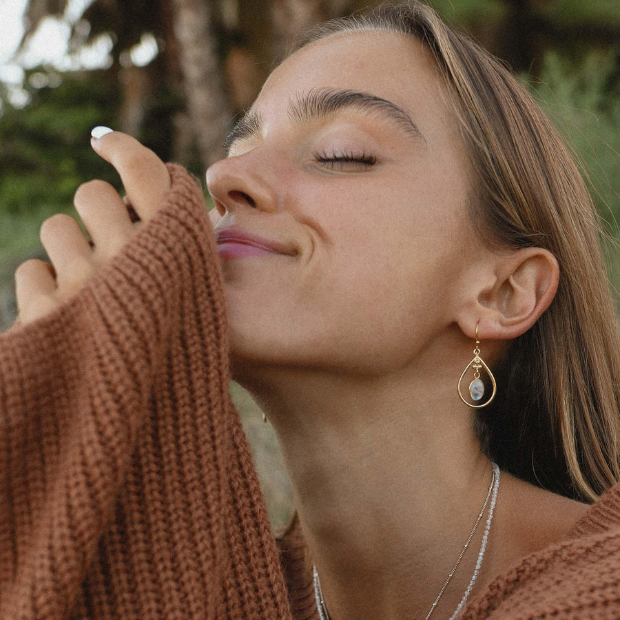 Woman wearing Gold Moonstone Earrings - womens jewellery by Australian jewellery brands indie and harper