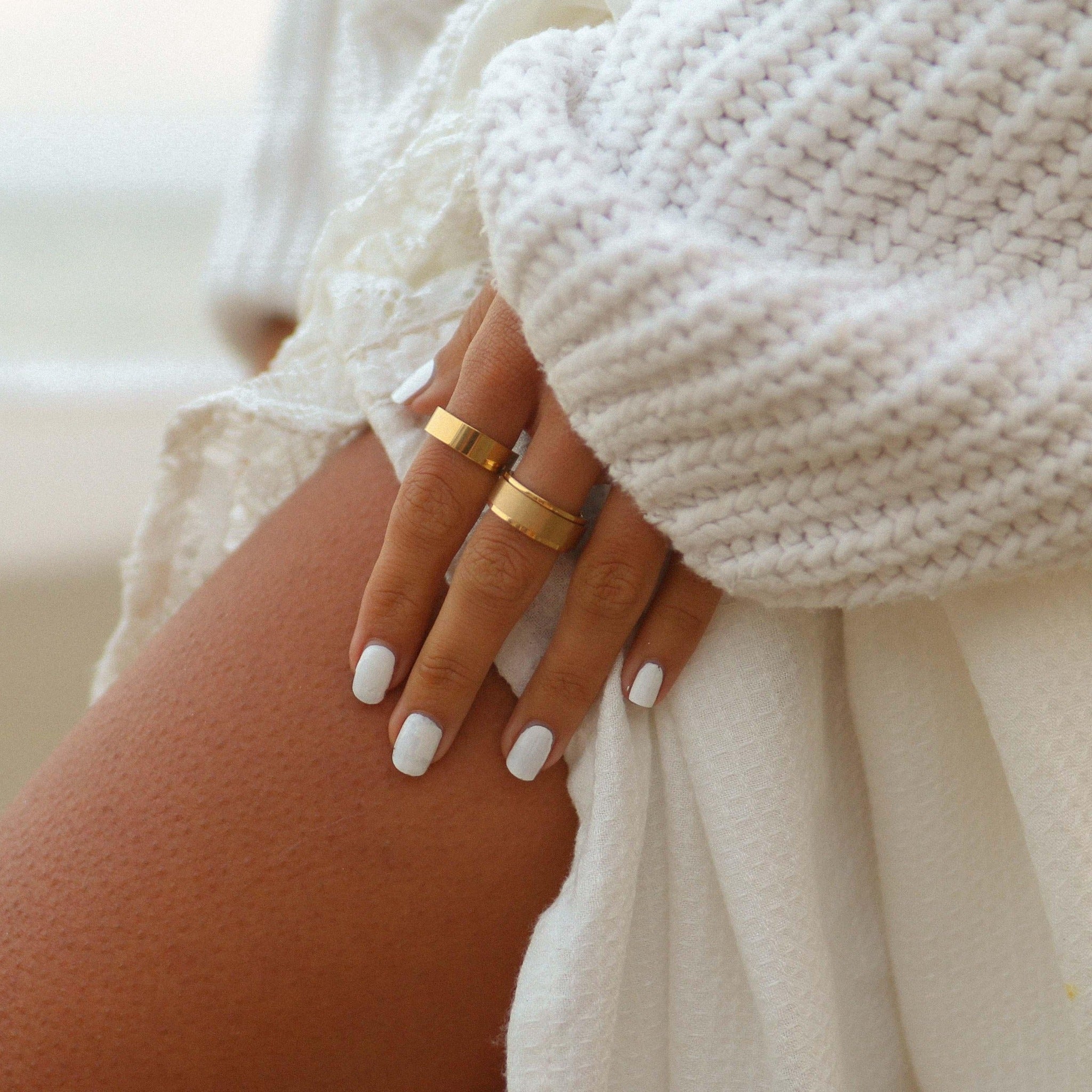 Woman wearing gold rings - gold jewellery by Australian jewellery brand indie and Harper 