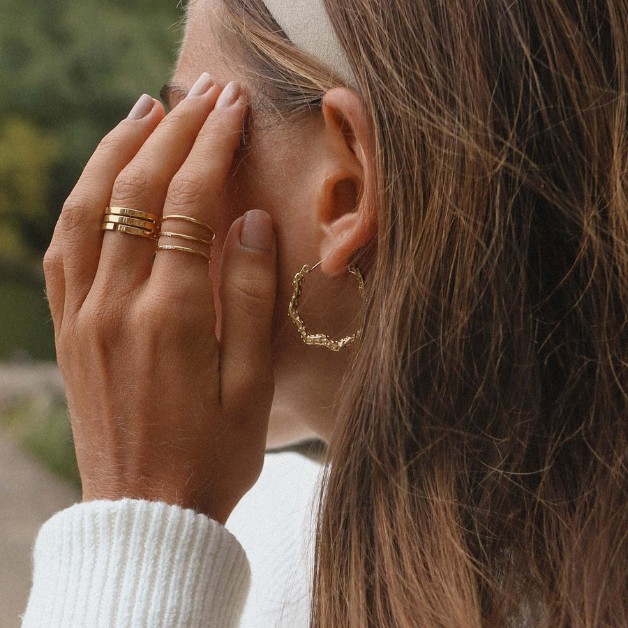 gold Rings and gold earrings being worn - womens jewellery by Australian jewellery brand indie and Harper