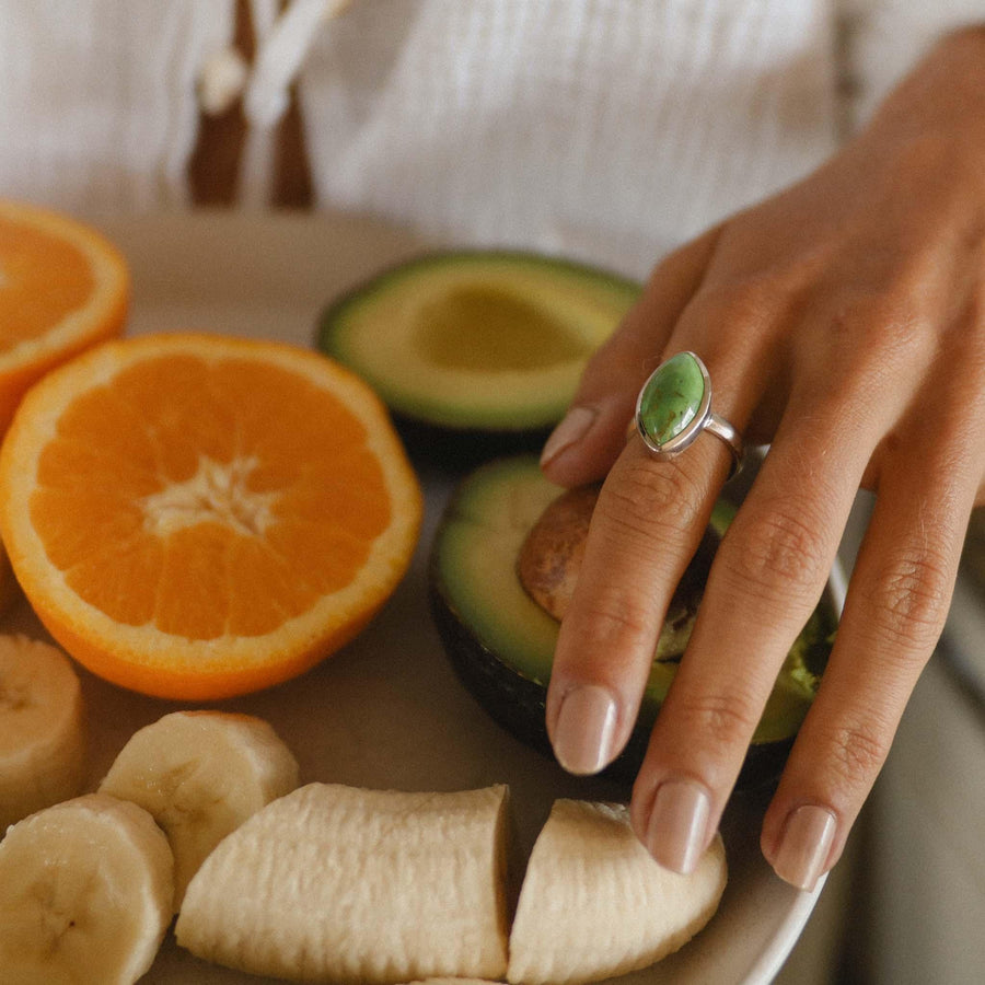 Woman’s hand wearing Green Turquoise Ring - boho jewellery by australian jewellery brand indie and harper