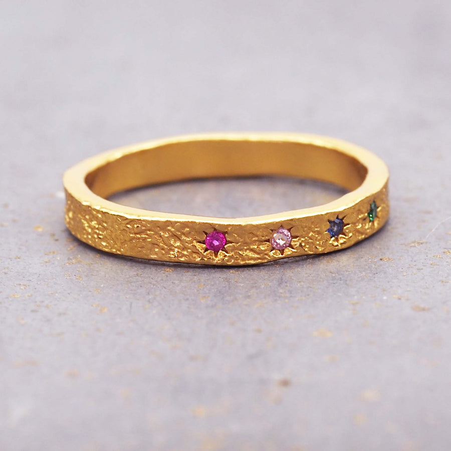 rainbow coloured cubic zirconia band rings made with gold plating over sterling silver and hammered detailing - women's online jewellery brand indie and harper