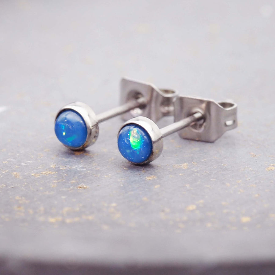 dainty earrings for women made with synthetic blue opals and stainless steel settings - dainty jewellery online by indie and harper