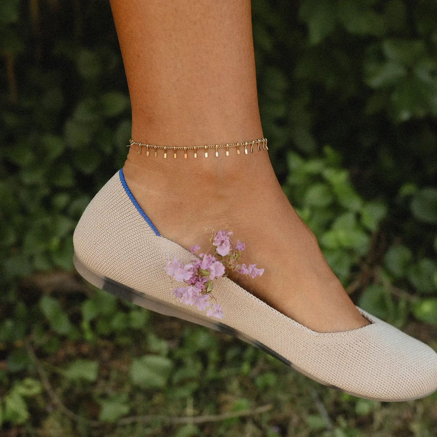 Woman wearing gold anklet - gold jewellery by Australian waterproof jewellery brands indie and harper