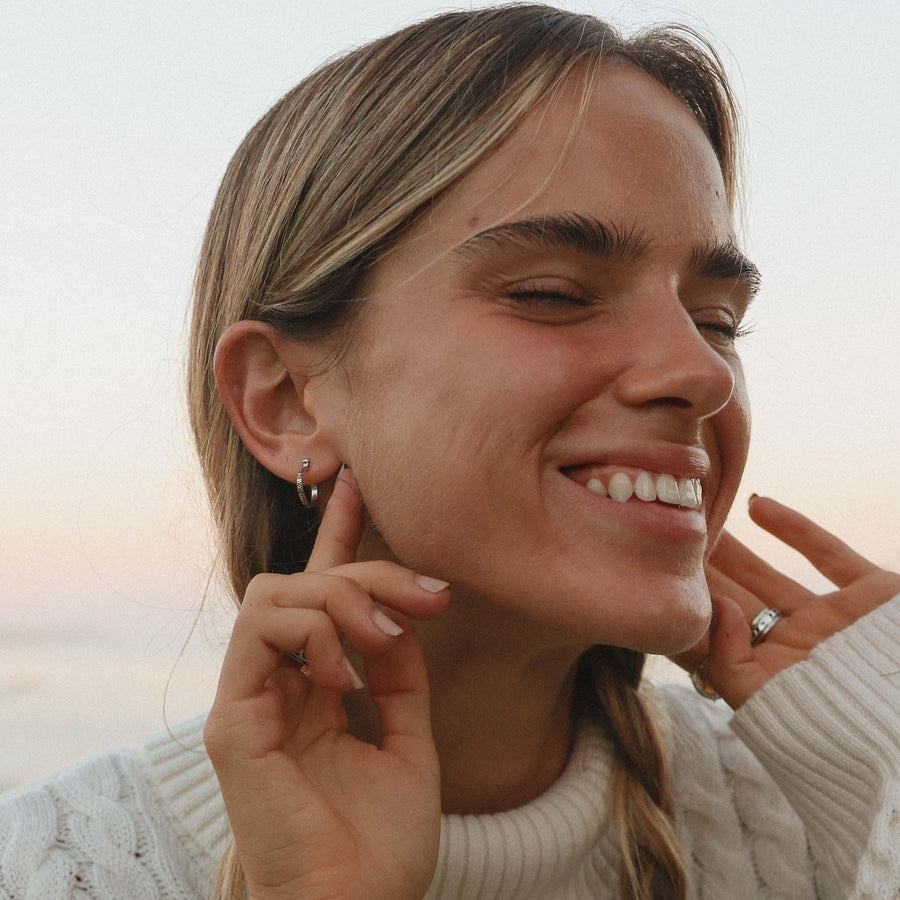 smiling girl wearing Dainty Luna sterling silver hoop earrings - womens jewellery by Australian jewellery brands indie and Harper 