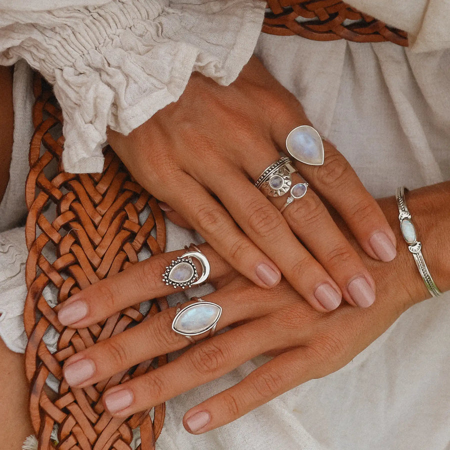 Woman wearing rainbow moonstone rings - boho jewellery by Australian jewellery brands online indie and Harper 