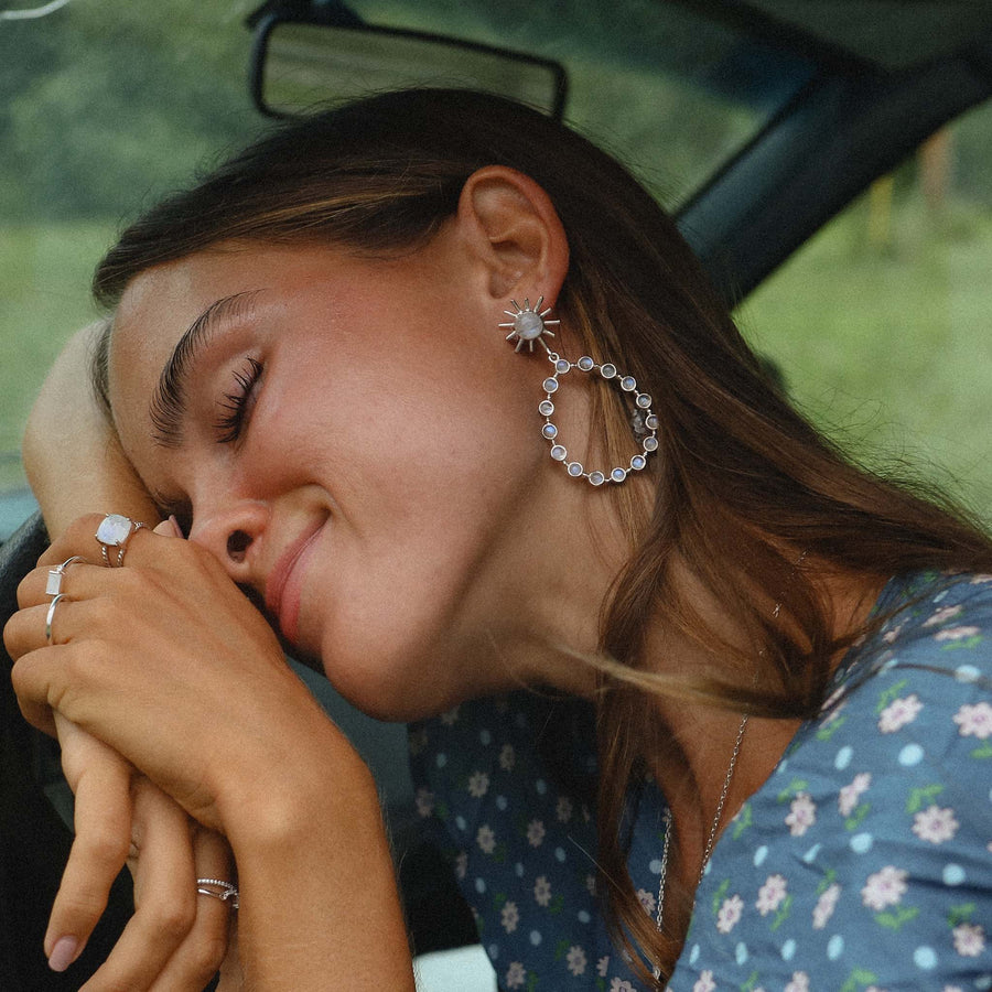Woman wearing statement moonstone earrings - womens moonstone jewellery Australia by online jewellery brand indie and harper