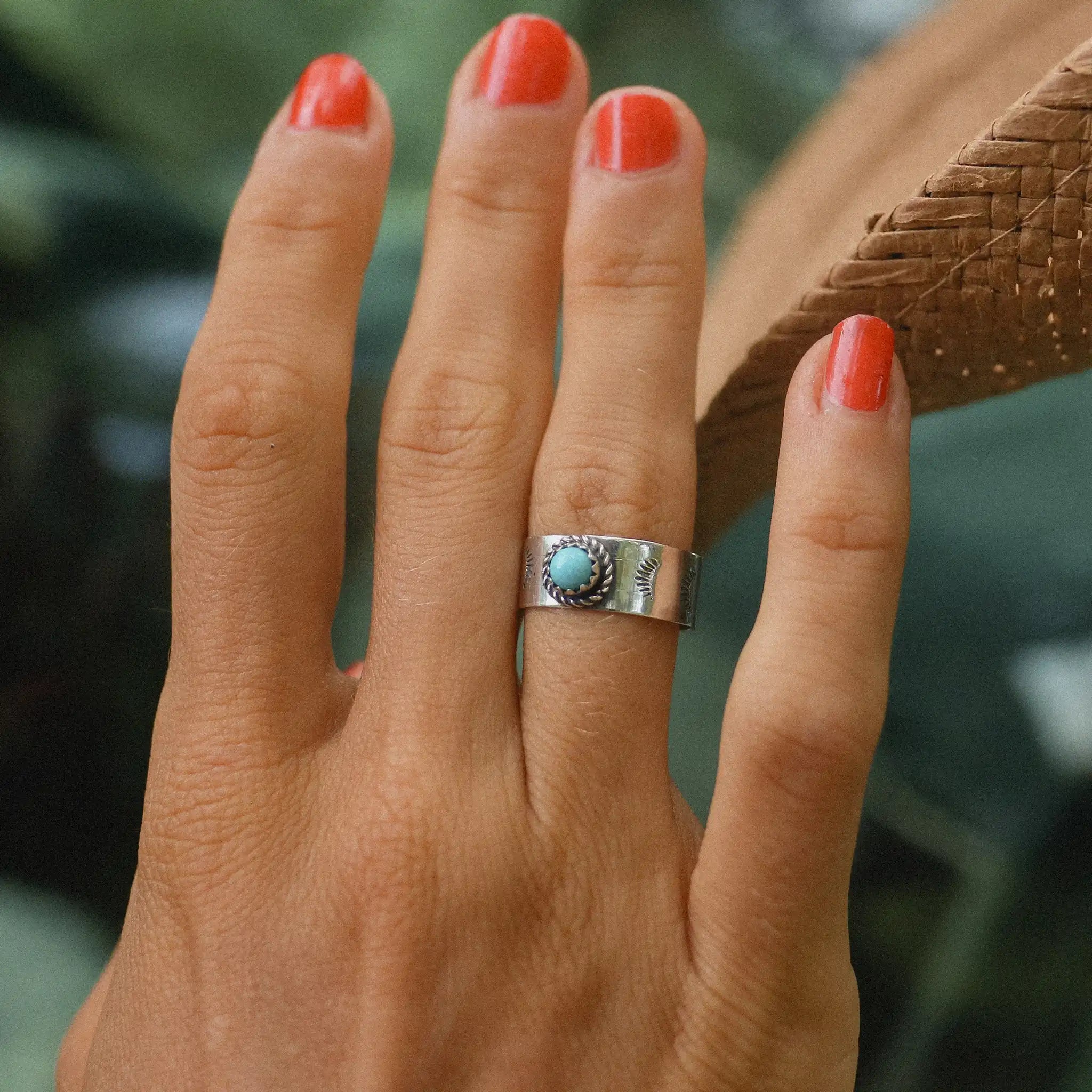 Woman with red nails wearing sterling silver turquoise ring - Native American jewelry by womens jewellery online brand indie and harper